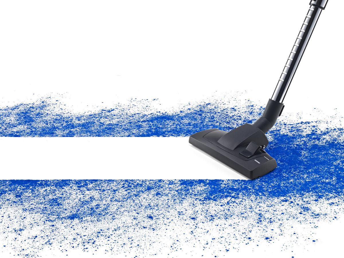 Blue powder being vacuumed